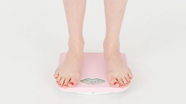 woman-checking-weight-on-scales